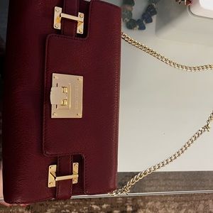 Burgundy Micheal Kors purse in mint condition .